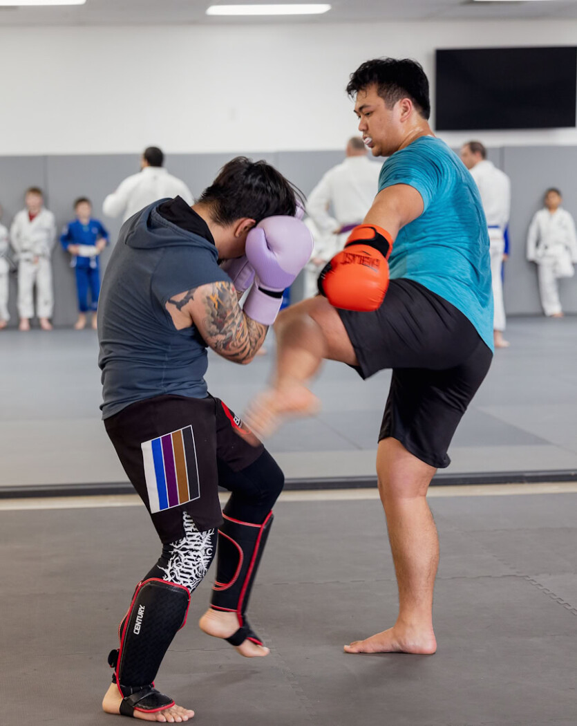 Two young men sparring during a Muay Thai Kickboxing class