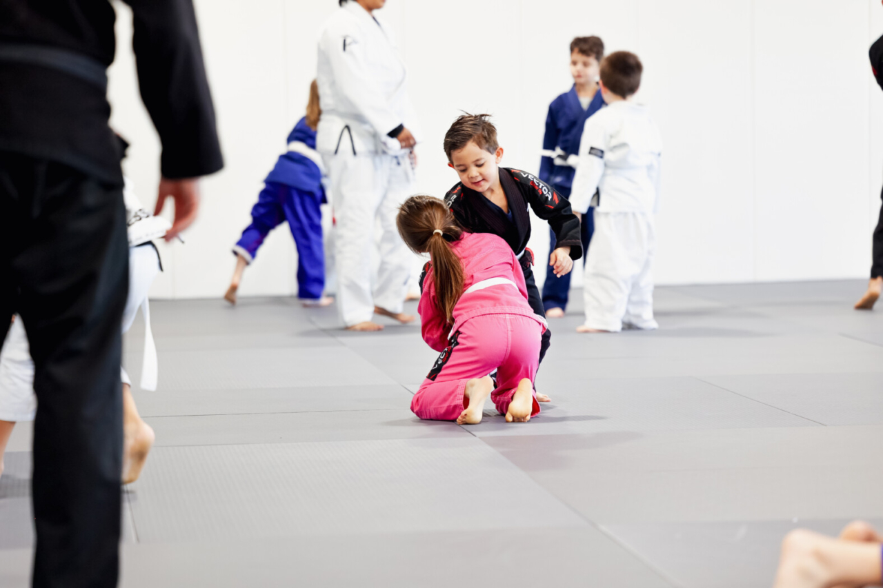 Image of Progresso Jiu Jitsu Frisco Kids posing as a group