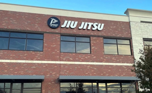 Plano building front with Progresso Jiu Jitsu logo on it