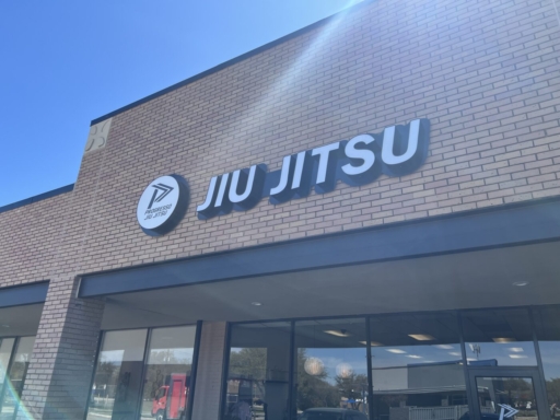 Plano building front with Progresso Jiu Jitsu logo on it